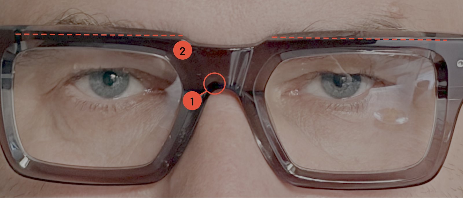 Close-up of wide-face glasses with a 19 mm bridge: a visible gap between the bridge and the nose, and the top rim sitting on the eyebrow line